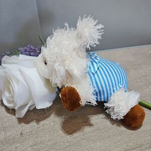 Doodalou Plush Lamb Pacifier Holder With Blue Striped Bathing Suit.